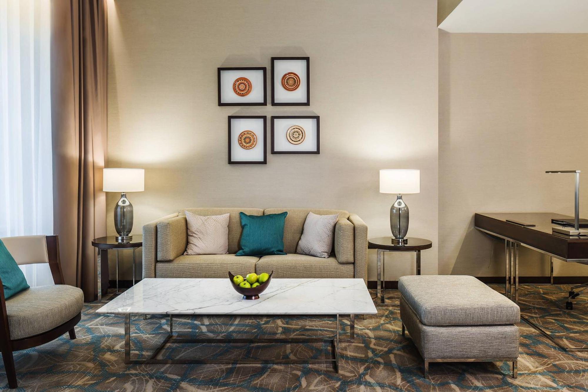 Jw Marriott Bucharest Grand Hotel Exterior foto A living room at the hotel